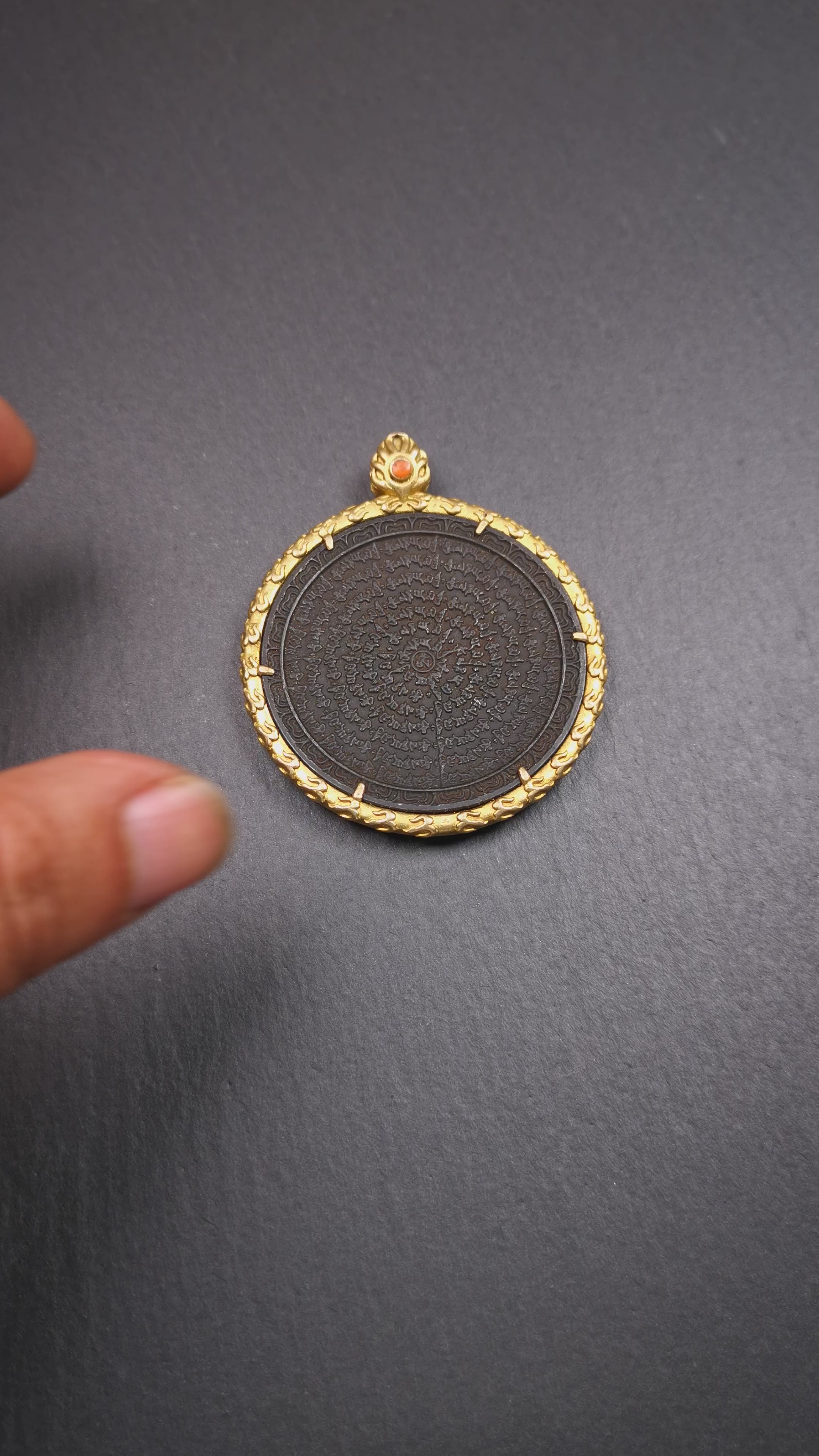 This badge is made by Tibetan craftsmen and come from Hepo Town, Baiyu County,Tibet. It is made of thokcha, edging with copper,round shape, 2.52 inche diameter. The OM MANI PADME HUM mantra arranged in concentric circles.