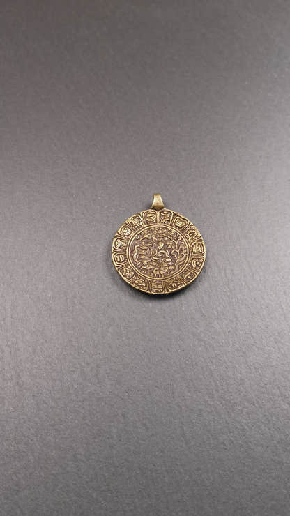 This Longevity Badge was handmade by Tibetan craftsmen and come from Hepo Town, Baiyu County, Tibet. It is made of brass,round shape,the theme is the god of longevity,surrounded by the symbols of Ashtamangala.