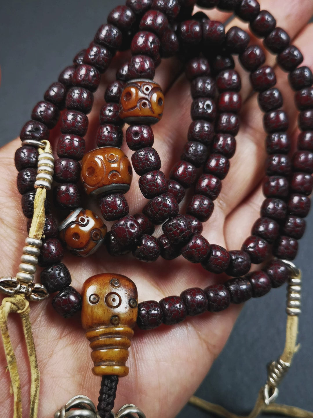 This mala is made by Tibetan craftsmen and come from Hepo Town, Baiyu County,Tibet, the birthplace of the famous Tibetan handicrafts,about 30 years old,blessed by a lama in Baiyu Monastery. It's composed of 108 pcs 8mm lotus seed beads,then add some old bone beads,1 pair of silver bead counters,and silver guru bead,vajra pandent 