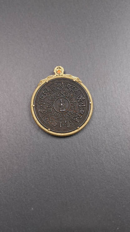 This badge was made by Tibetan craftsmen and come from Hepo Town, Baiyu County,Tibet. It is made of thokcha, edging with copper, 2.1 diameter. The mantra Om Mani Padme Hum is arranged in concentric circles around the chenrezig.