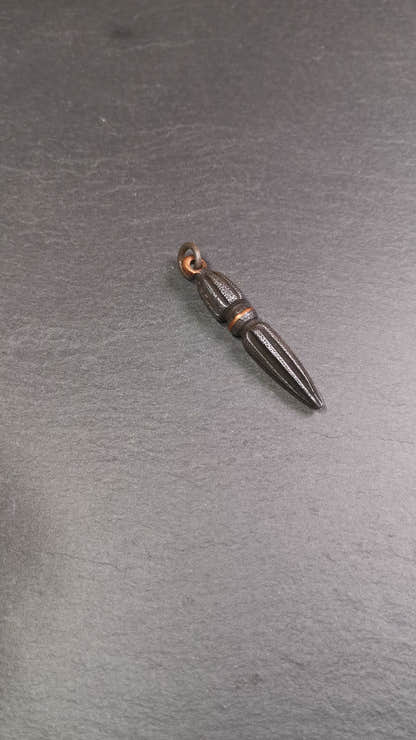 This handmade Dorje Phurba was crafted by Tibetan craftsmen from Hepo Town, Baiyu County, Tibet. The length is 2.5 inches,black color,the upper part is a vajra, and the lower part is a phurba. A copper wire is inlaid on the waist of the phurba.
