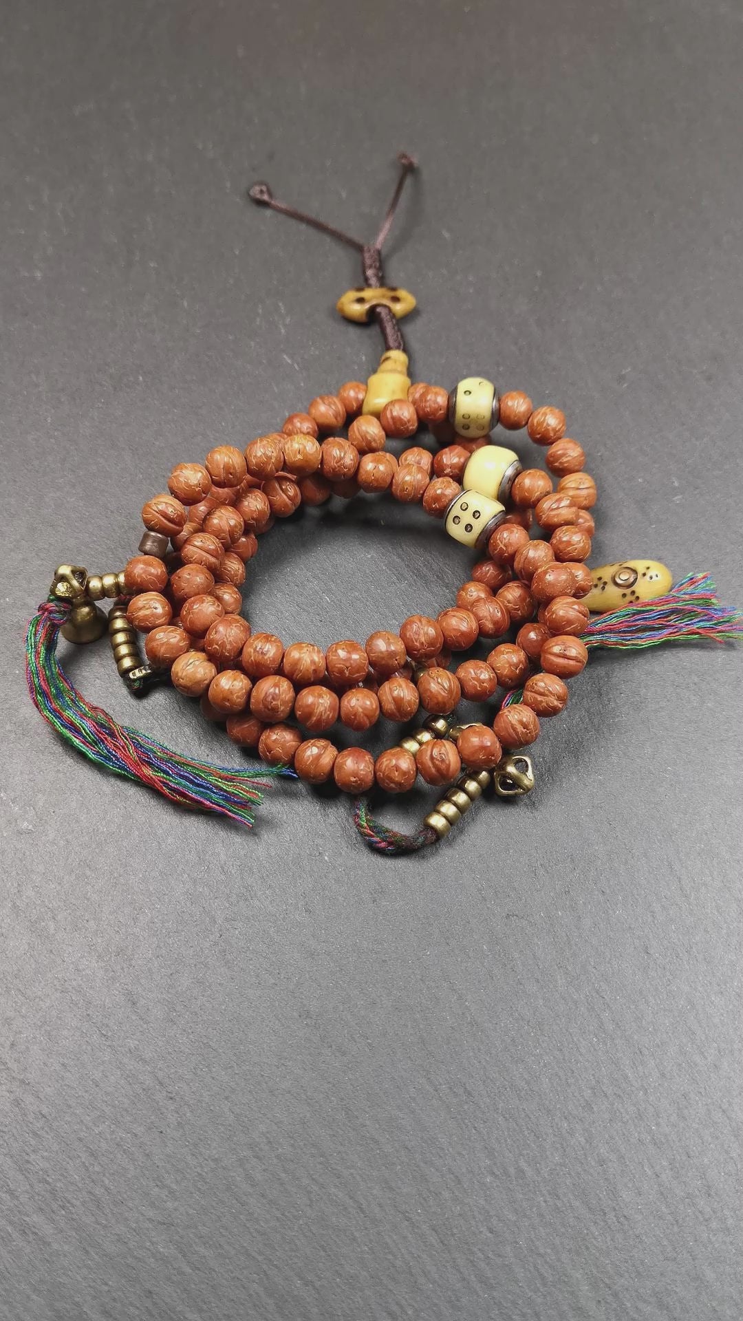 This bodhi beads mala is made by Tibetan craftsmen and come from Hepo Town, Baiyu County, the birthplace of the famous Tibetan handicrafts,about 30 years old, hold and blessed by a lama in Baiyu Monastery.  It is composed of 108 bodhi seed beads, and is equipped with 3 yak beads,copper bead counters are installed on both sides, 1 copper bead clip, 1 bone pendant bead,and finally consists a bone vajra on the end, very elegant.