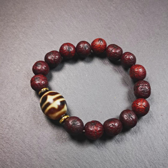 This unique Dalo Dzi bracelet combines the mysterious and unique qualities of the tiger tooth dalo dzi and 15 old bodhi seed beads,giving it a distinct feel.  It is brown in color and has a circumference of approximately 7 inches, suitable for most wrist sizes. 