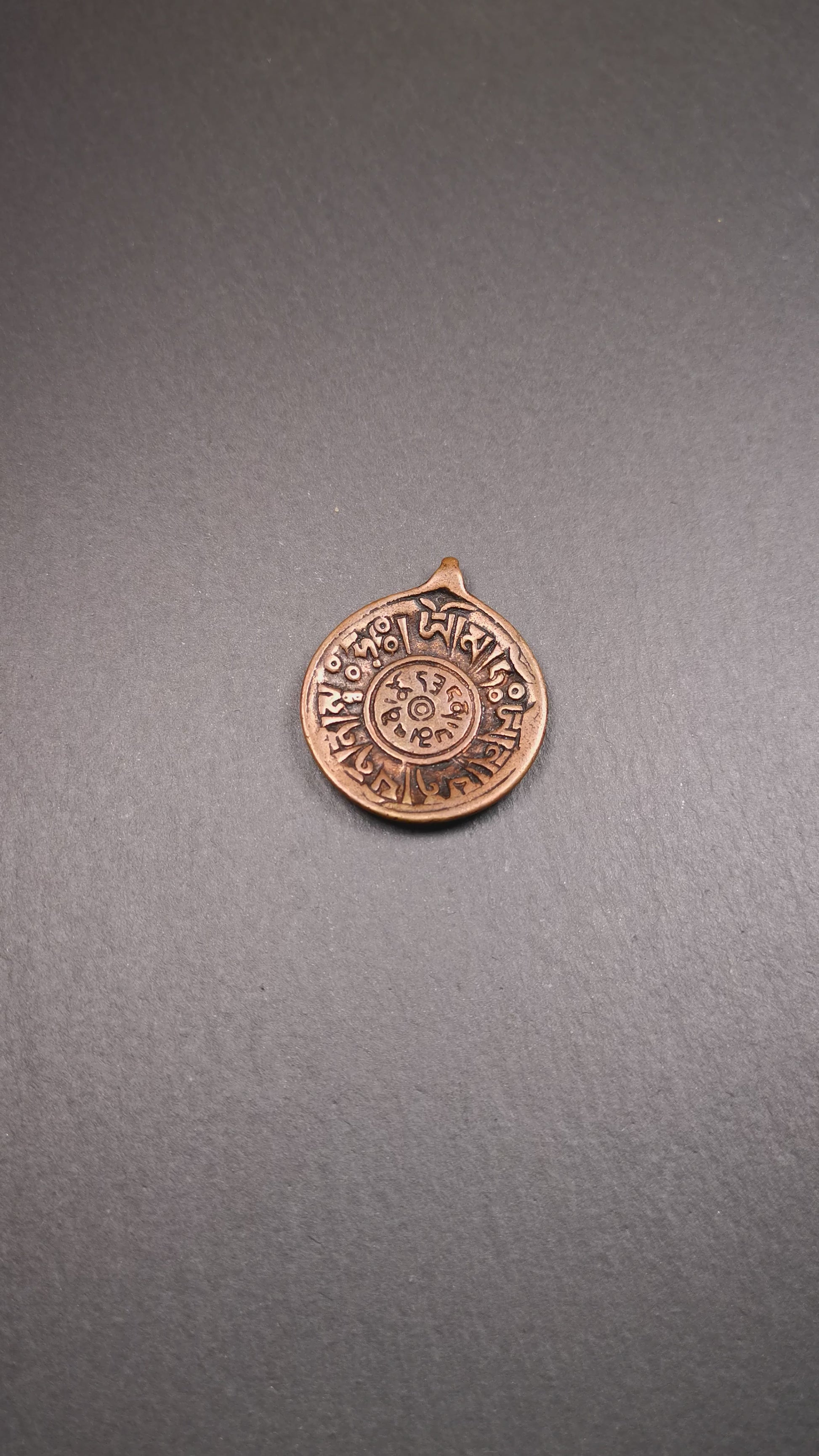This Om badge amulet was collected from Yushu City Tibet,about 50 years old. It is round shape,made of lima brass, 1.46 inches,carved with mantra of chenrezig OM MANI PADME HUM. You can make it into a necklace, or a keychain, pendant