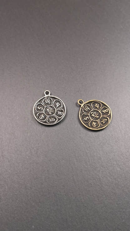 This om badge was made by Tibetan craftsmen and come from Hepo Town, Baiyu County, the birthplace of the famous Tibetan handicrafts. It is round, made of brass or white copper, 1.26 inches,carved with mantra of chenrezig OM MANI PADME HUM.