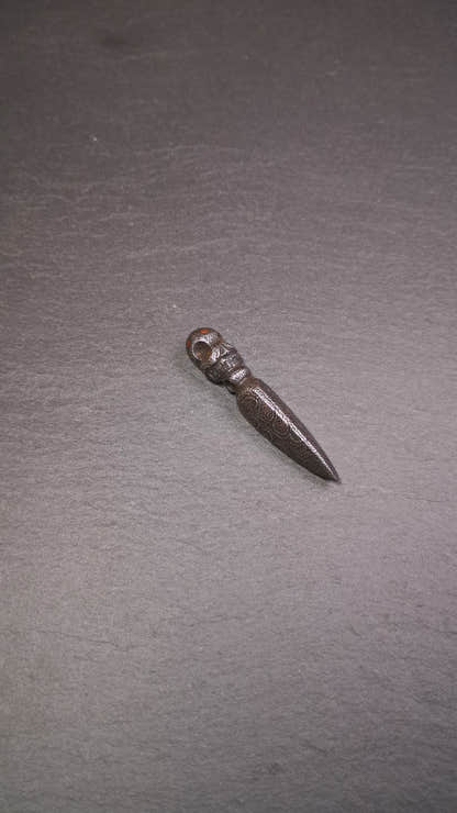 This phurba was made by Tibetan craftsmen and come from Hepo Town, Baiyu County, the birthplace of the famous Tibetan handicrafts. Its upper part is Shmashana Adhipati skull, the lower part is a Dorje Phurba, three copper dots inlaid on it